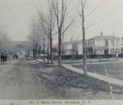 Standing on Main Street in front of church parsonage looking north. The horse and buggy is actually in the intersection of East and West Shore Road.