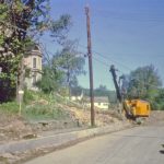 Looking north on North Main Street. High School is in the background. Grenier's has not been moved yet. O'Connor house on the left. 27