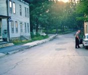 Red VanderWerker, Water Commissioner on right. Former central house on left. M-19