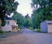 Standing in front of the current post office and Looking south on Main Street - English's market on left and Edward' Oil Company on right. Notice the creek that goes under 395 behind the oil company. Guess they never thought about flooding. M-22