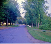 Looking down (east) on Fairview Ave (currently Alexander Rd.) to where the new 395 would connect. Dutcher home in the backround. M-6