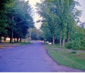 Looking down (east) on Fairview Ave (currently Alexander Rd.) to where the new 395 would connect. Dutcher home in the backround. M-6