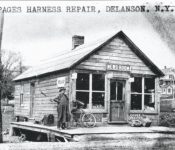 Harness Shop and news room operated by James Paige on south Main street right next to the creek where gazebo is located. Courtesy of the Duanesburg Historical Society,