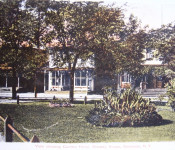 Photo was taken from what is now the Village Parking lot looking west at the Central House and Gardner Grocery Store from the train station garden