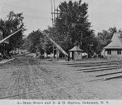 Railroad crossing looking north. Railroad station is on the right Railroad crossing